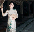 TrucHy Vietnamese ao dai ivory and blue, pants included
